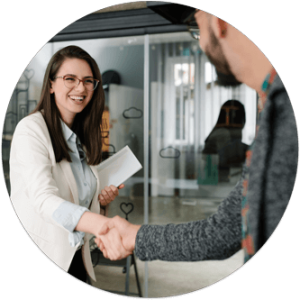 people meeting and shaking hands at Start My Wellness office