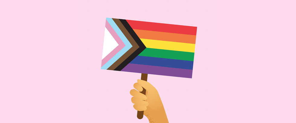 person holding pride flag for pride month