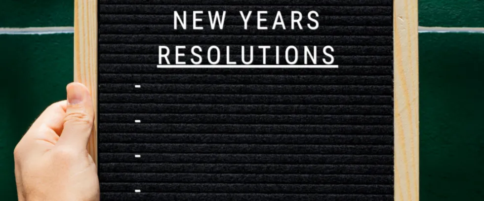 board that reads new years resolutions but is blank