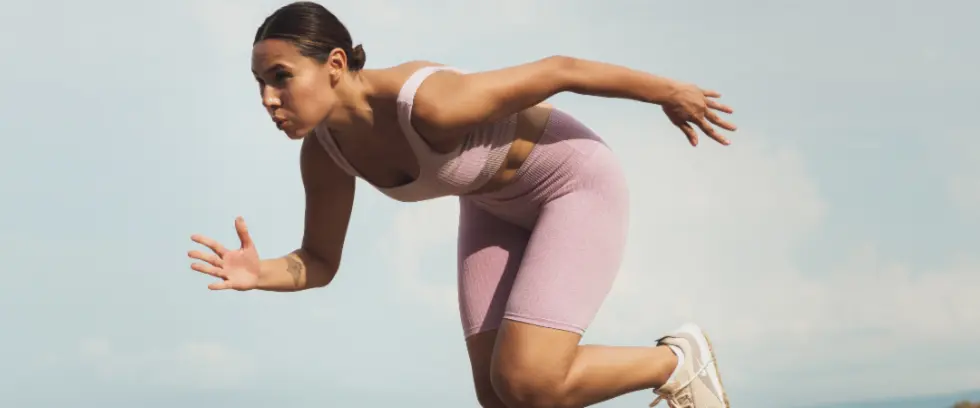 Athletic woman exercising and running to improve her mental health